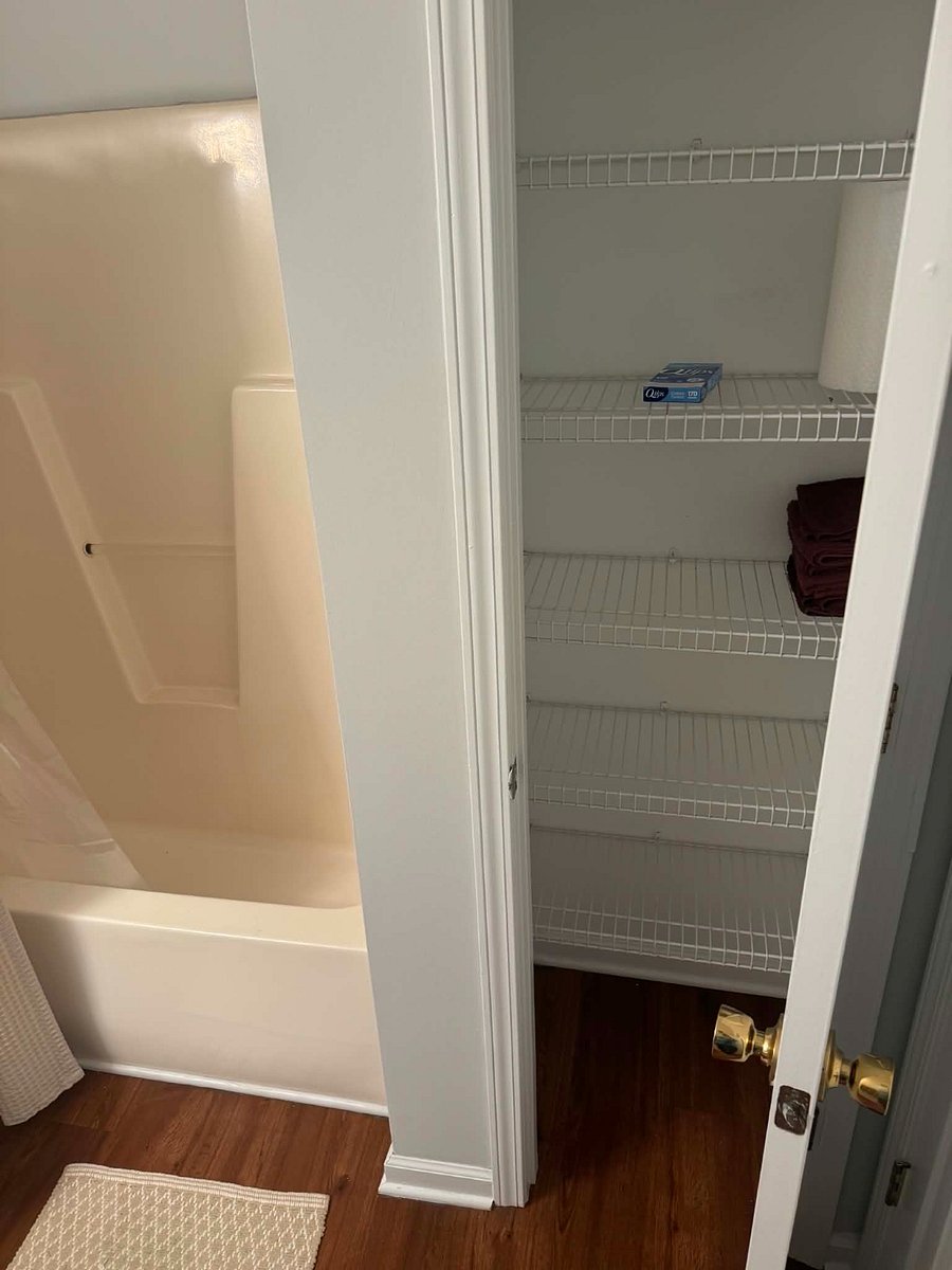 Bathroom closet with shelving