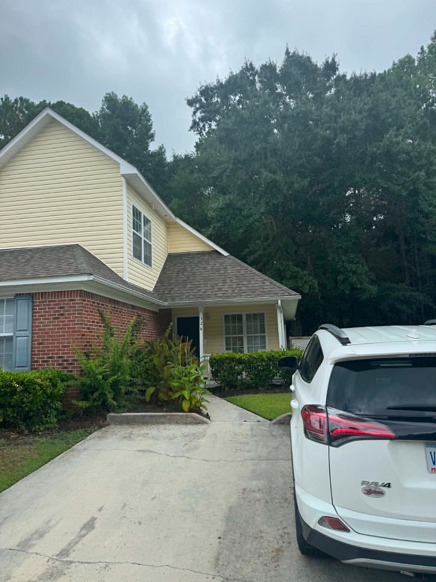 Covered front porch and dedicated parking space
