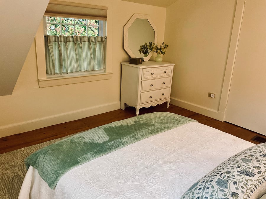 Second bedroom with small dresser and closet