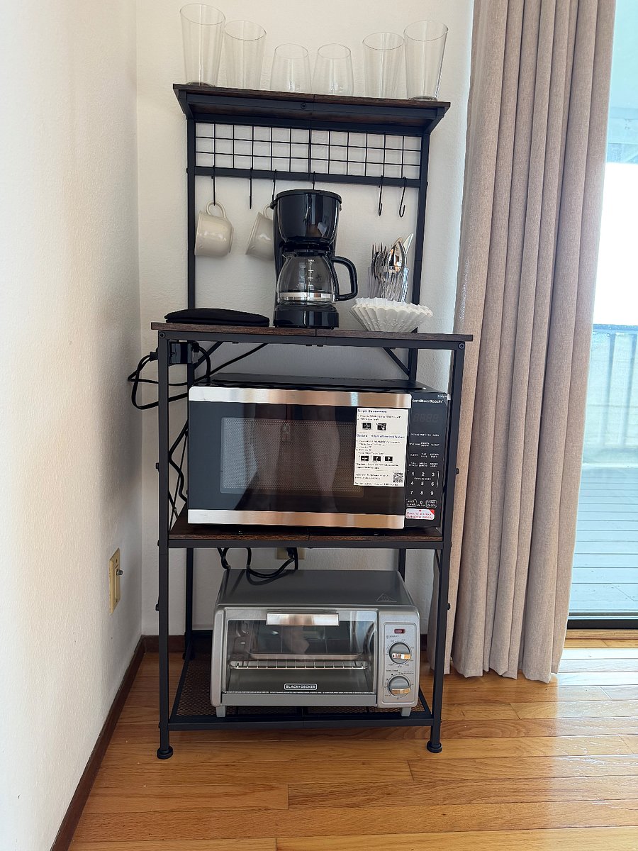 Master bedroom suite
Bakers rack with glasses, coffee maker, microwave, toaster oven, etc.
