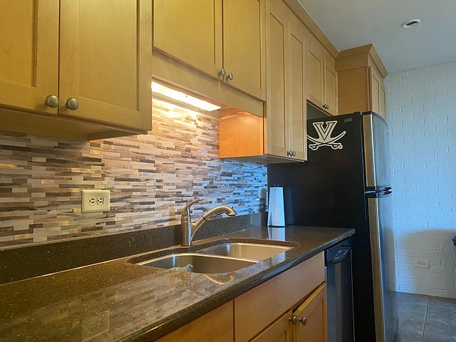 Nicely equipped kitchen with a Nespresso coffee maker, electric tea kettle, toaster, cooking utensils and cookware, dishes, and linens