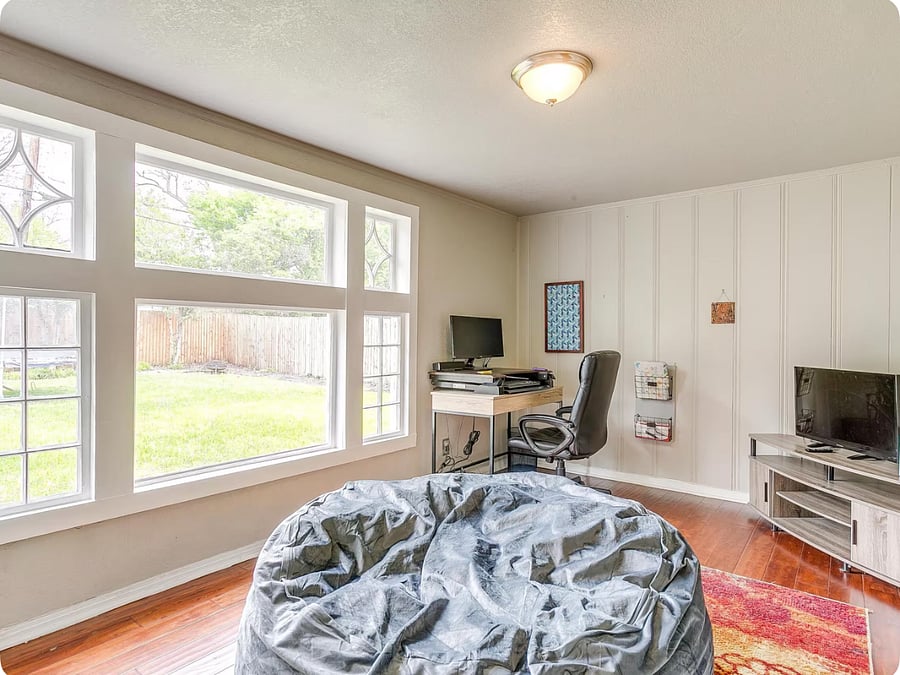 Bright workspace & cozy lounge with TV, bean bag and backyard views  1st floor