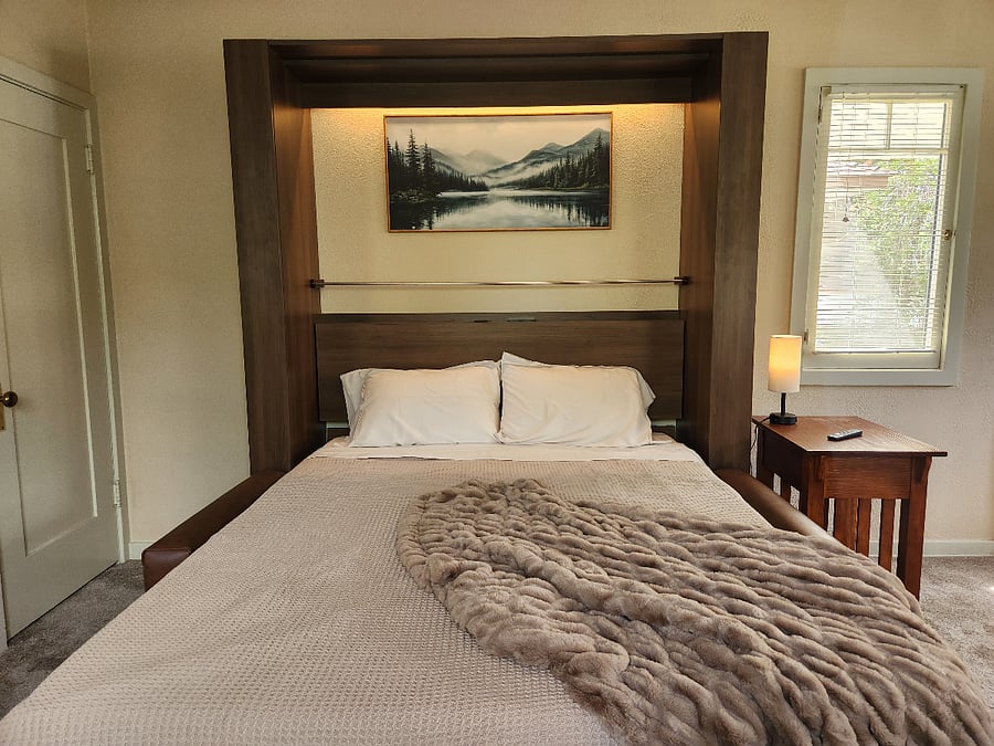 The queen-size bed includes sheets, blanket and comforter with reading light and USB chargers.