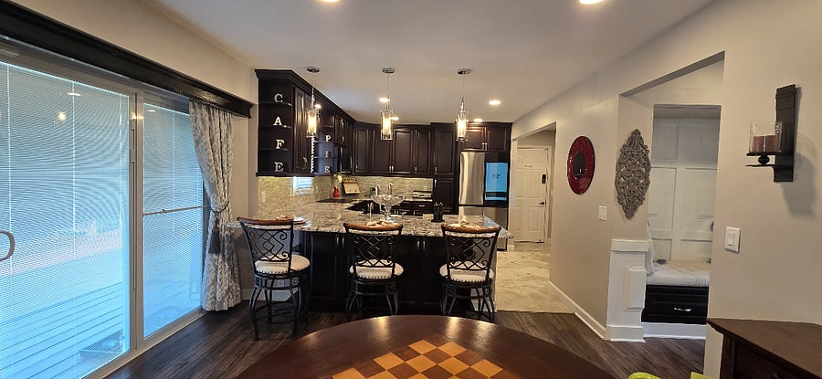 Kitchen area from living/ family room featuring kitchen seating area