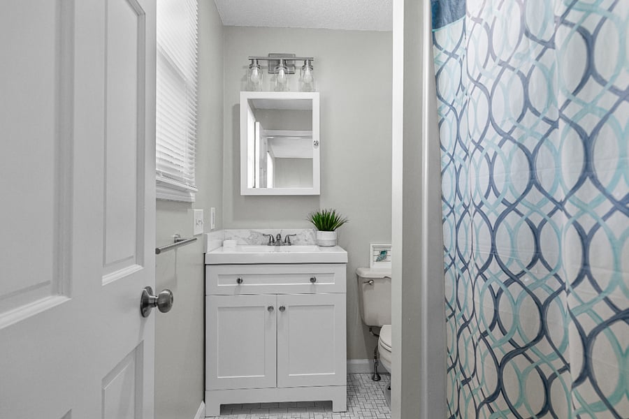 Ensuite full bathroom to the master bedroom featuring a shower and fresh towel sets provided.