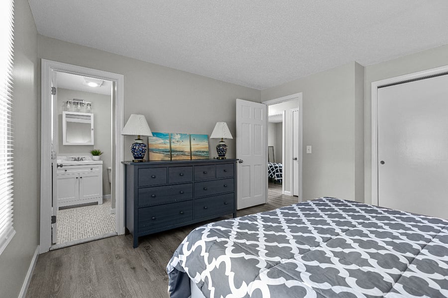Master bedroom with a plush queen mattress, crisp linens, and integrated blackout curtains for day-sleeping. Sorry we are in the process of getting new professional photos and this picture doesn't show the blackout curtains.
