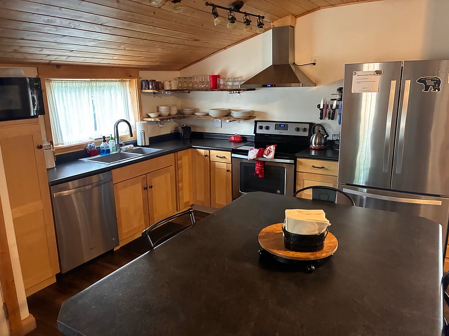 Full kitchen, dishwasher, stove, fridge, microwave, coffee maker. Fully stocked with everything you'd need. Laundry just off of kitchen.