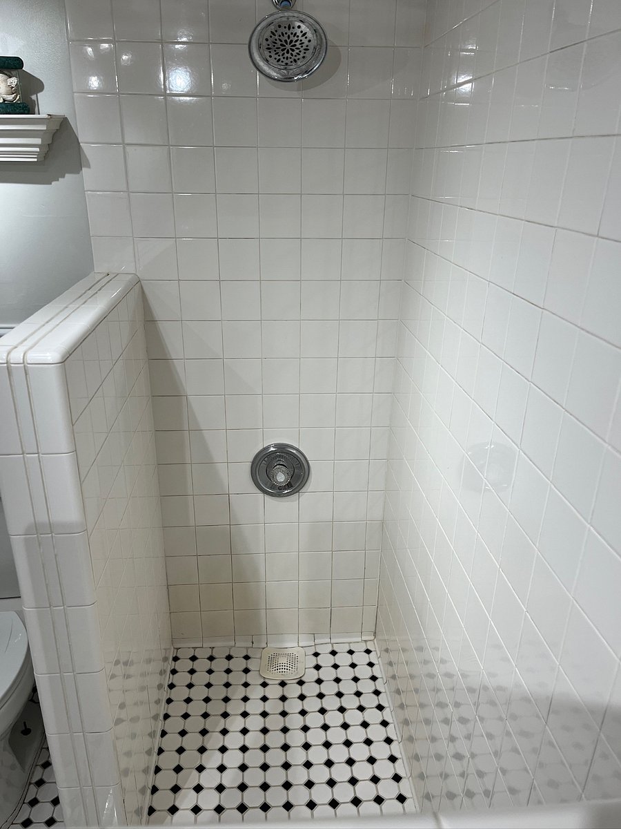 Upstairs bath walk-in shower with bench