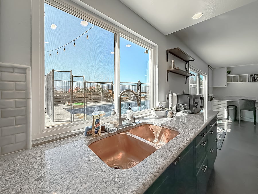 Furnished Kitchen Sink with Balcony View