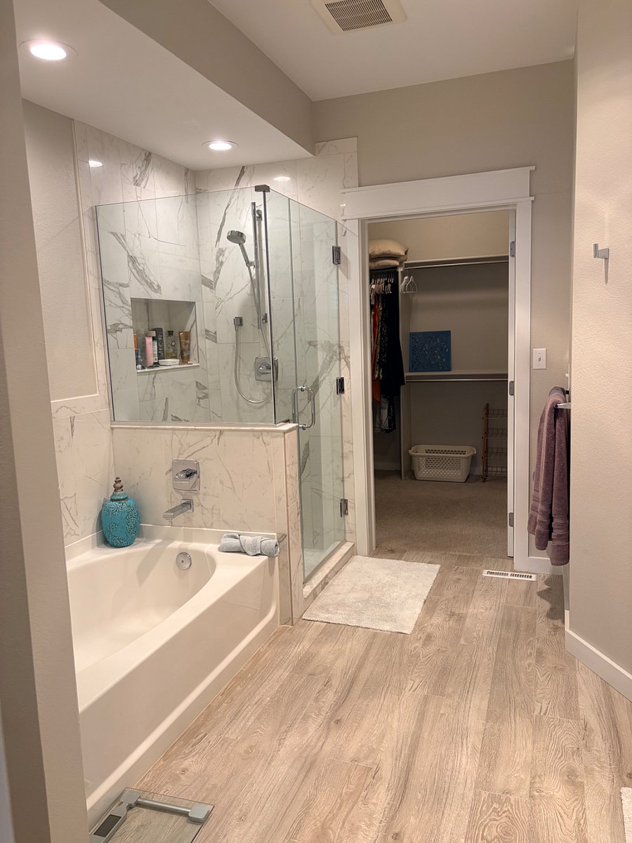 Shower and tub area in master bathroom.