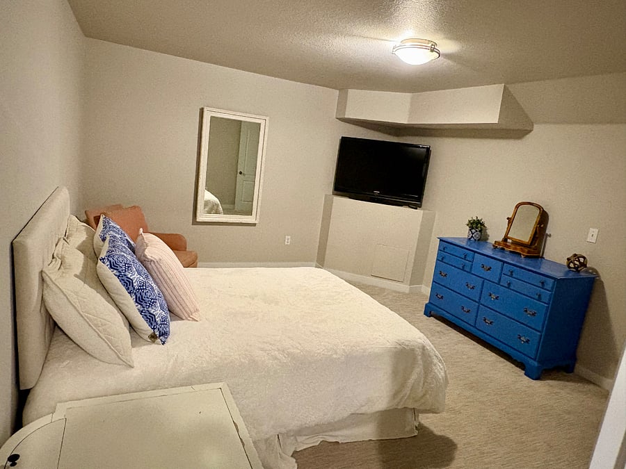 Lower level bedroom in the basement.  Double bed.