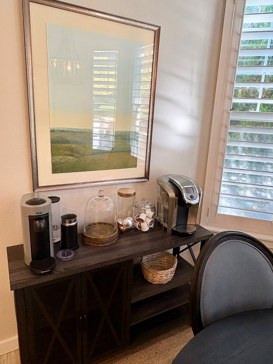 Coffee bar with Nespresso and Kuerig machines in kitchen nook.