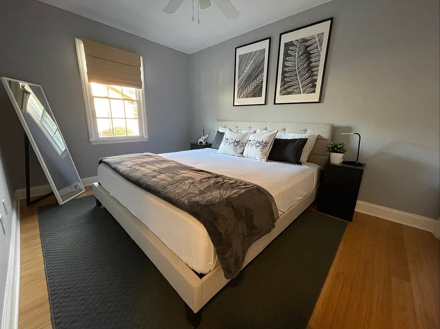 Guest Bedroom with king size bed, closet, and dresser.