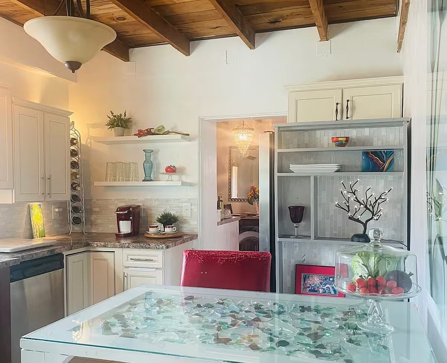 The table in the kitchen is an original door from the adobe with glass pieces found on  local walks.