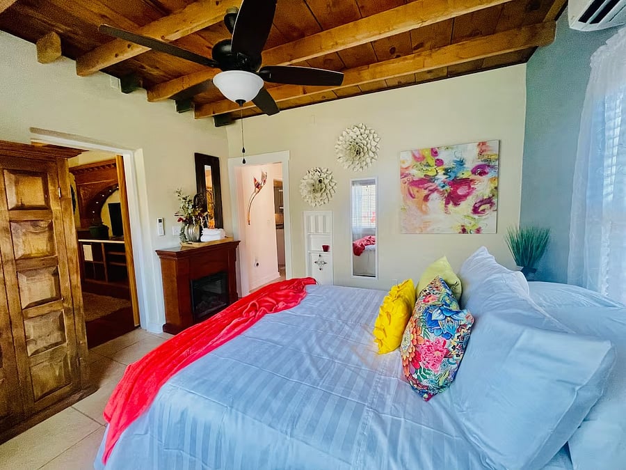 Bedroom has exits with barn doors to the dining and TV rooms.