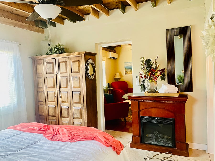 5' Wooden wardrobe provides space for hanging clothes and storage.
