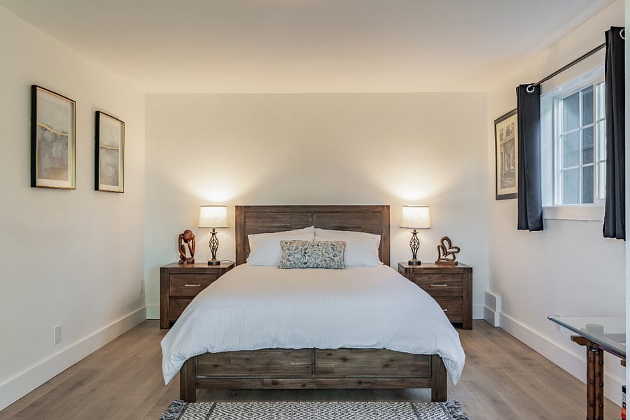High quality mattress, handsome furniture, peaceful surroundings, and blackout curtains guarantee a good night's sleep.