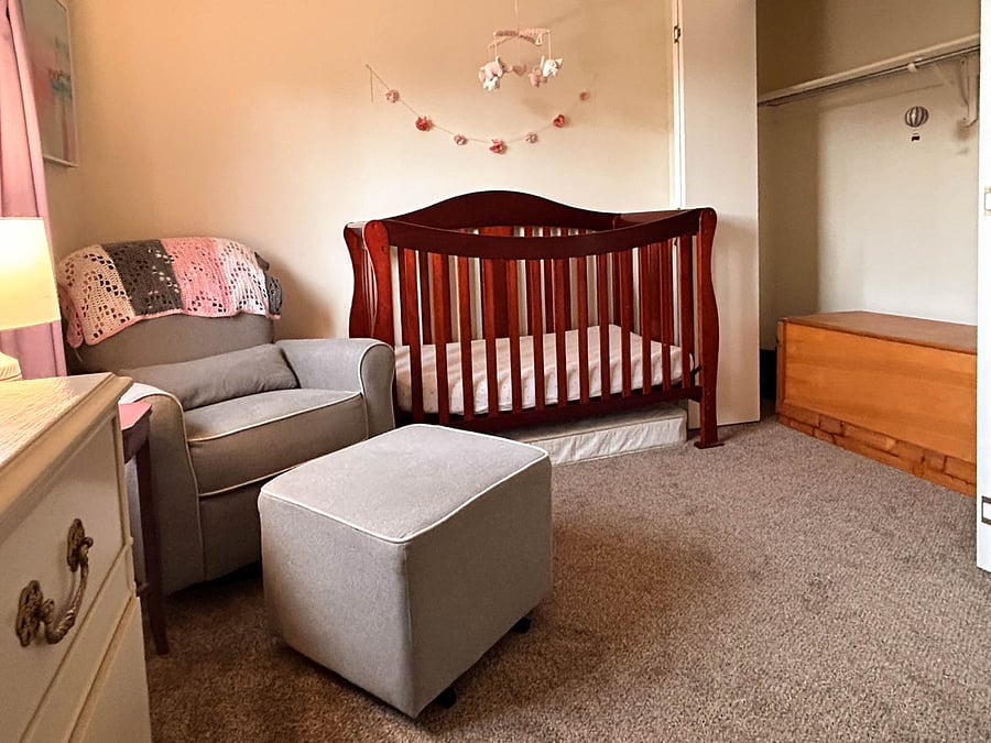 Baby room with large closet and quilts/blankets inside chest.