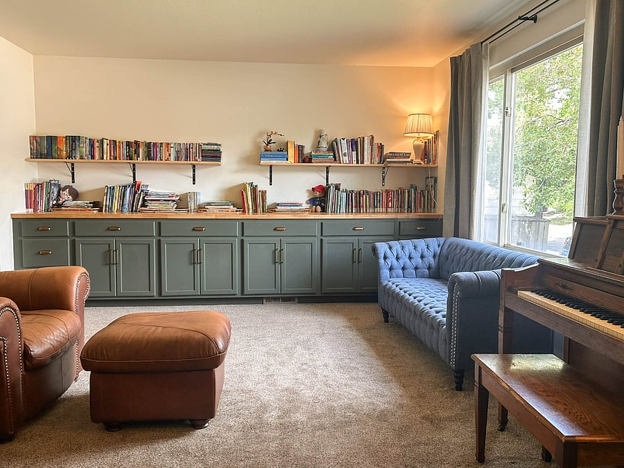 Sitting room and library with views of neighborhood trees