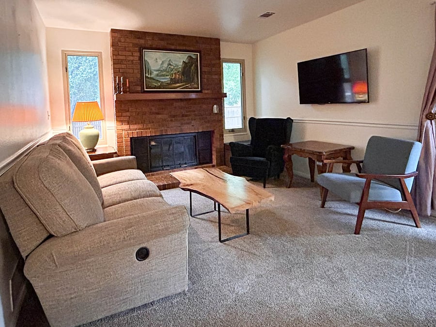Den with TV and gas fireplace (inspected annually).