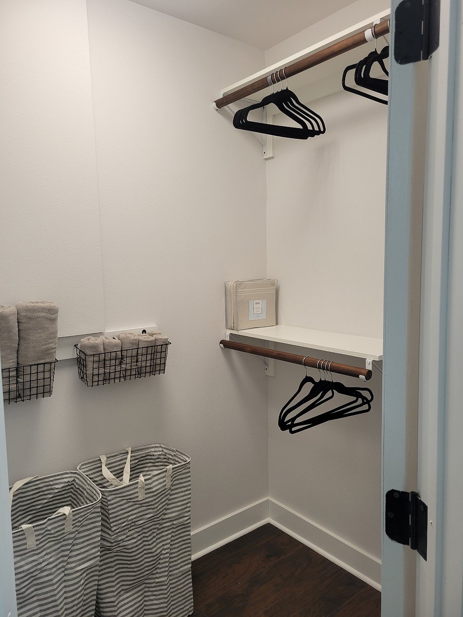 Primary bedroom walk in closet