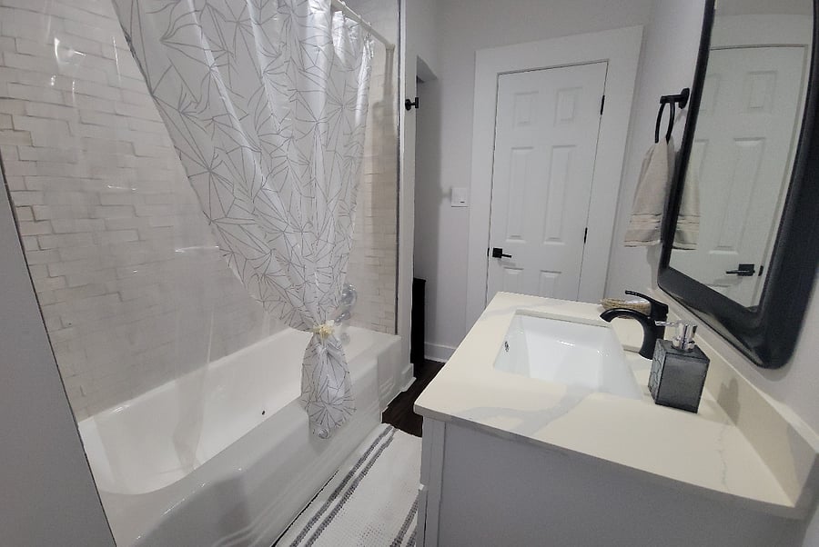 Hall bathroom with vintage iron tub