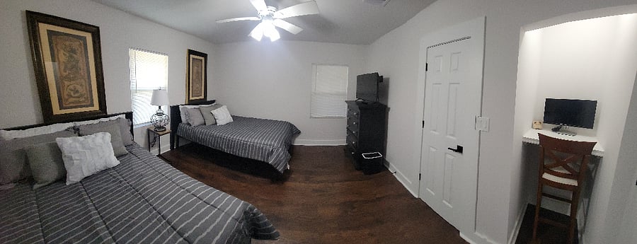 Second bedroom with two double beds and study niche