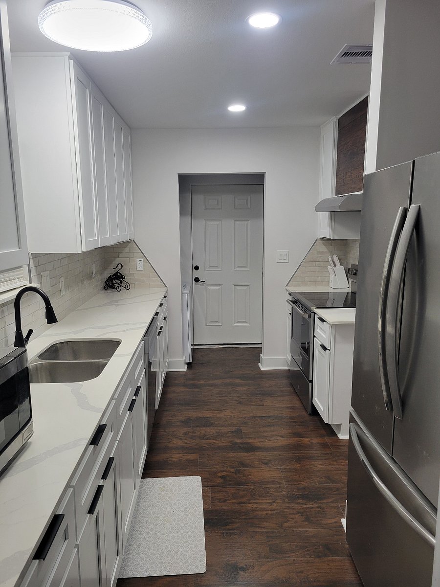 Fully stocked kitchen with access to garage and backyard