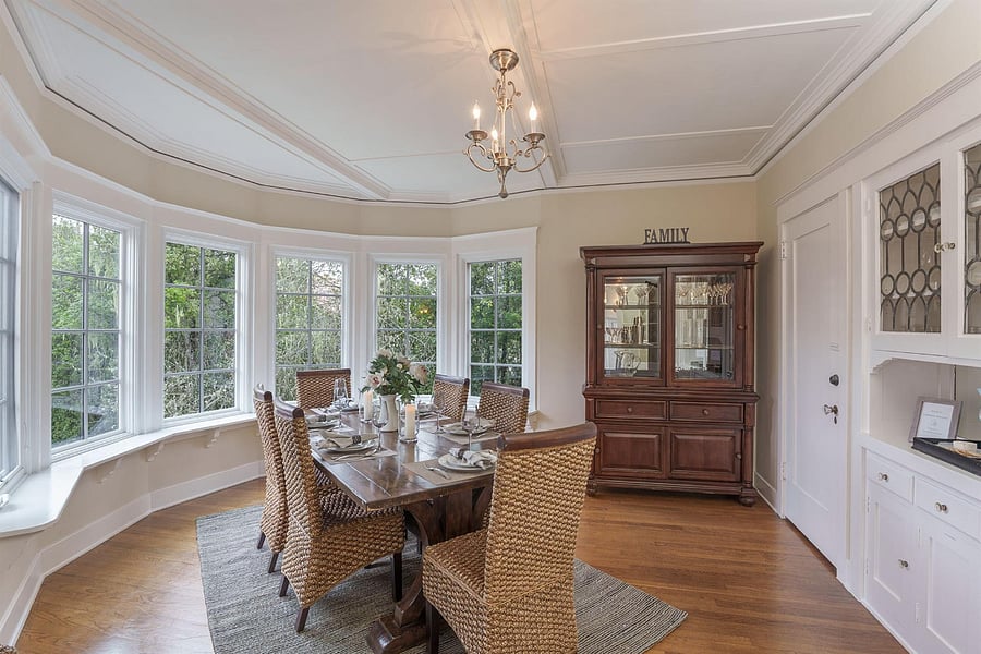 **Dining room w/ semi-circle of French windows & wood table that seats up to 10**