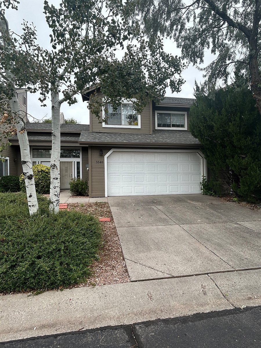View of front of townhome. Garage has room for one car.