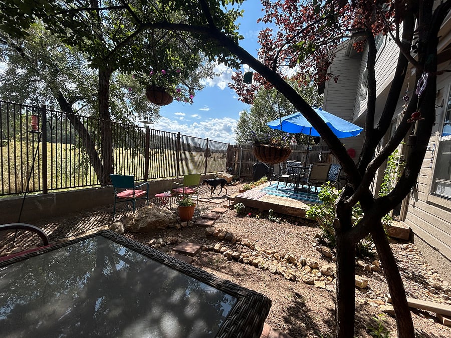 Backyard is a beautiful quiet space overlooking the meadow with morning sun and afternoon shade. Access mikes of trails from the back gate.