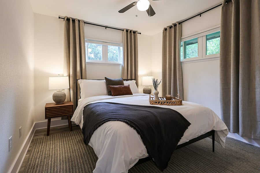 Master bedroom with luxurious Queen bed and 55" TV and en-suite bath