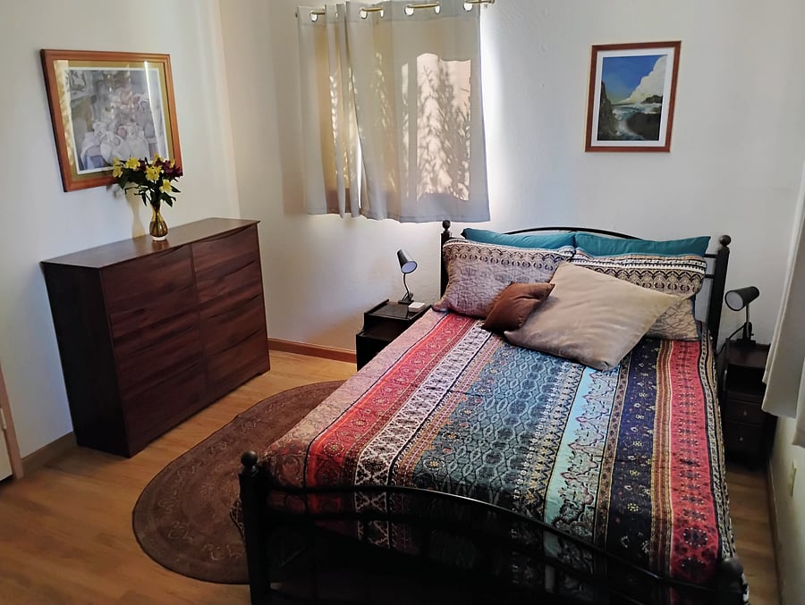 Bedroom showing the 8-drawer dresser.