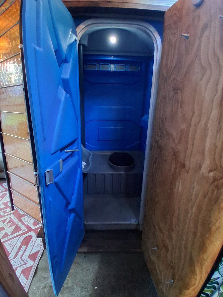 Honey Bucket is serviced professionally each month. It is clean and well-lit.