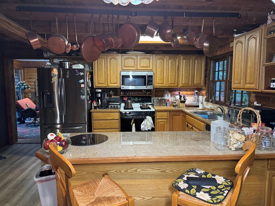 Shared kitchen includes gas stove/oven, microwave, coffee maker, food processor, toaster, toaster oven, full size fridge, dishwasher, seating for 2. Cookware, dishes, glasses, flatware are included.