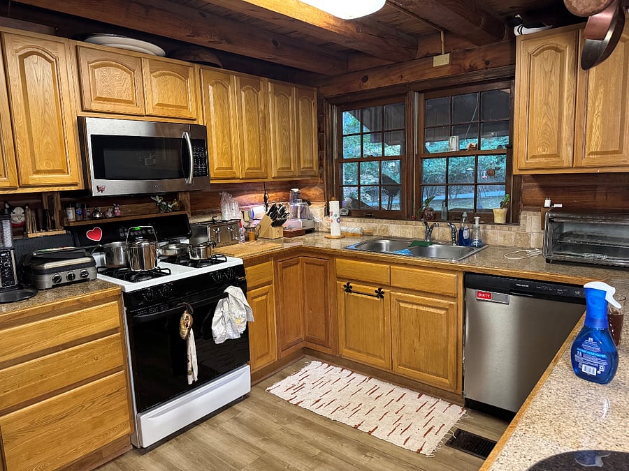 Shared kitchen includes gas stove/oven, microwave, coffee maker, food processor, toaster, toaster oven, full size fridge, dishwasher, seating for 2. Cookware, dishes, glasses, flatware are included.
