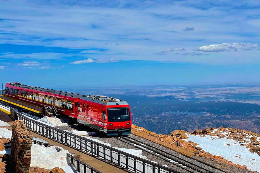 Ride the historic Pikes Peak Cog Railway for breathtaking mountain views and an unforgettable Colorado experiencejust a short drive from home!