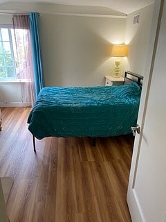Remote control lamp with switch in in the headboard and one at the door. The headboard has lights, and plug in for charging.

The projector for the home theater is above the bed, and screen is remote controlled. You can relax in bed and watch a movie.