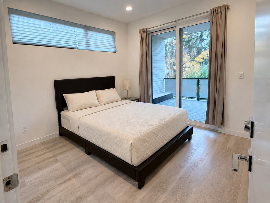 Main bedroom with direct access to the covered deck