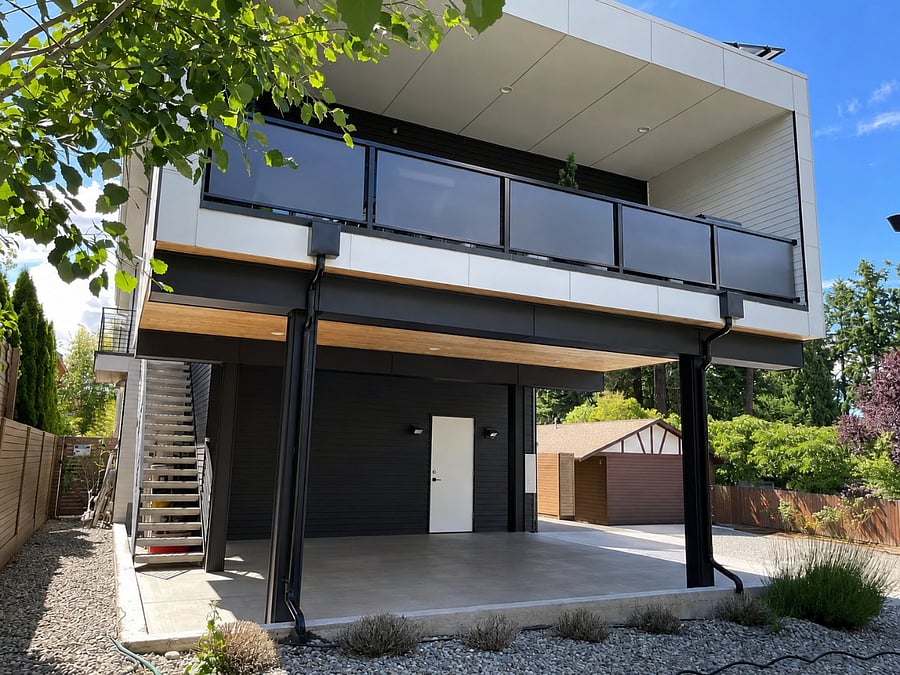 Exterior view with dedicated covered off street parking beneath the residence