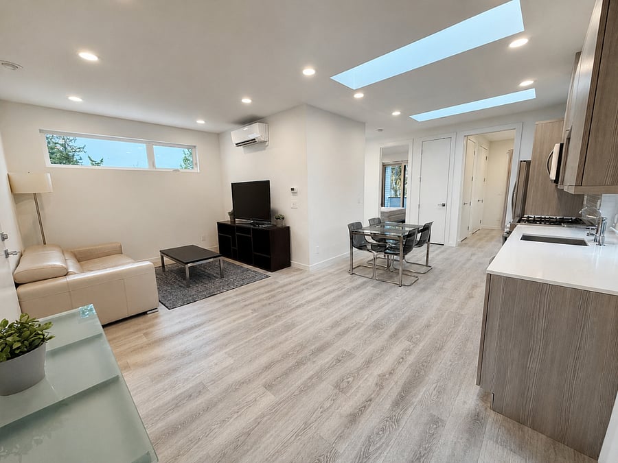 Wide view of the bright open living and dining space