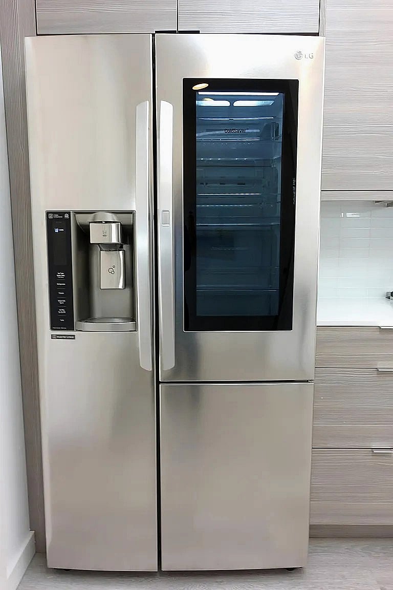 Full size LG refrigerator with door in door storage