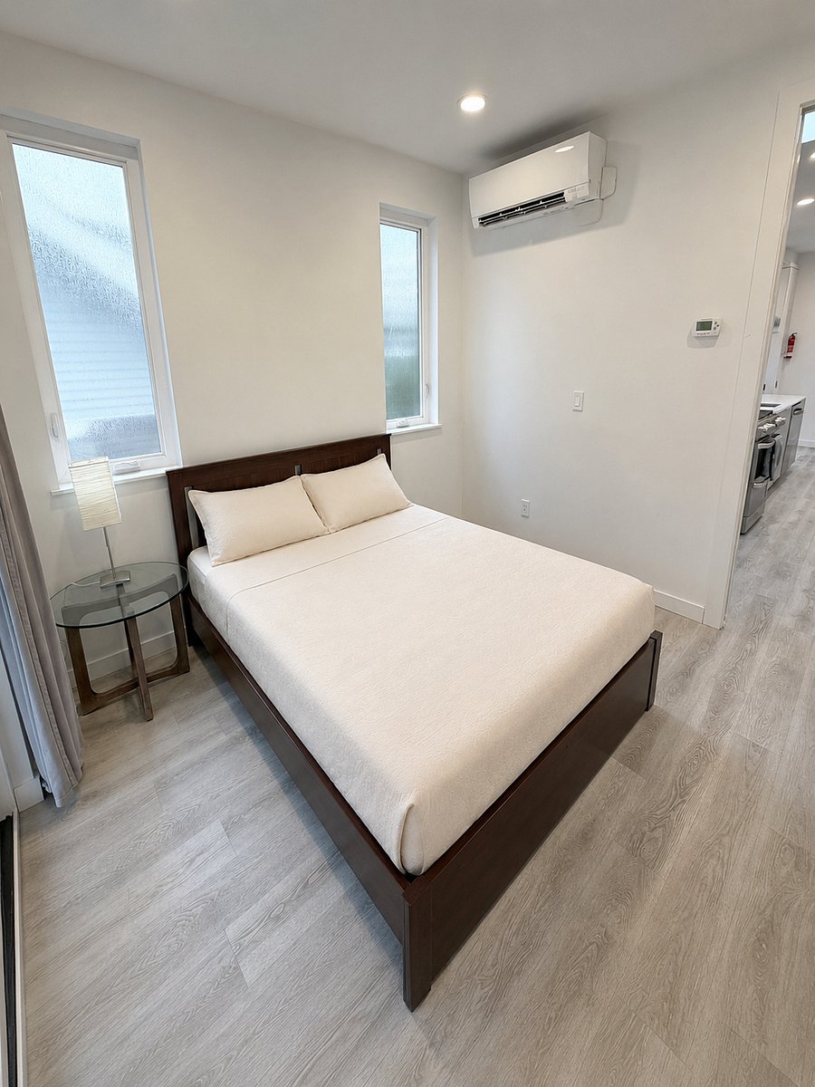 Second bedroom with view toward the living and kitchen area