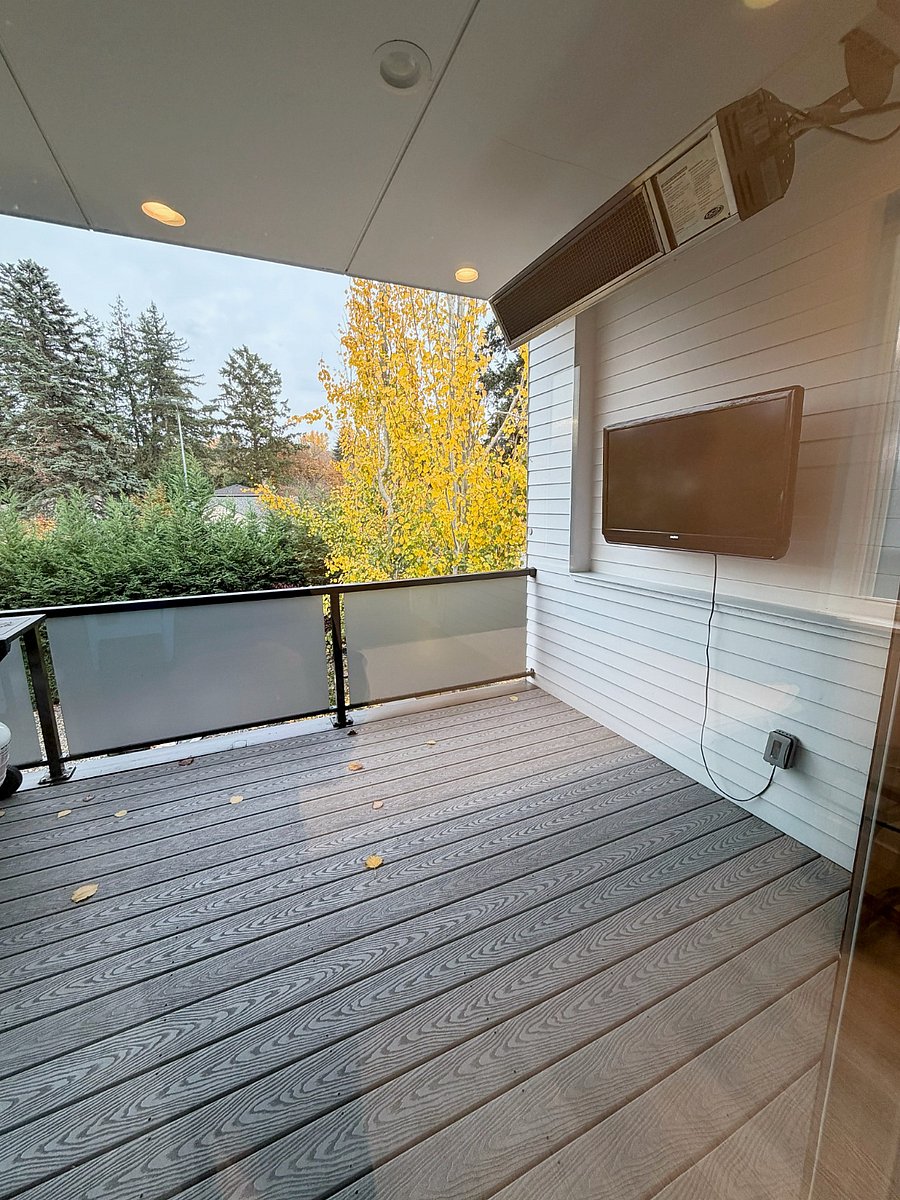 Covered deck with outdoor TV and overhead heating
