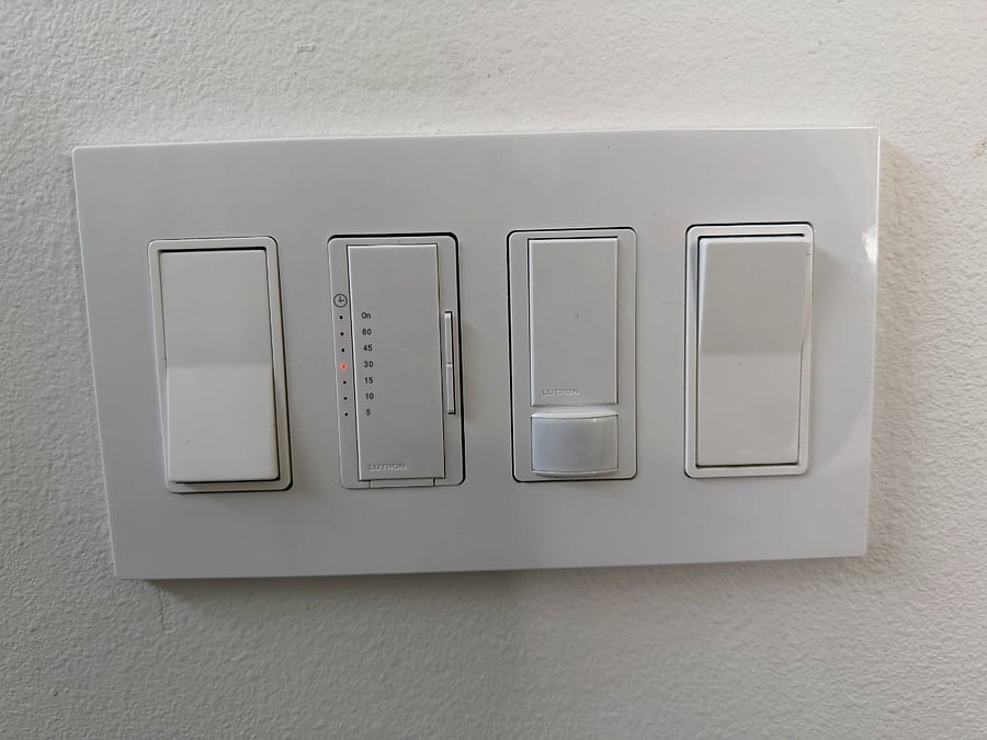 Lutron smart lighting controls with timer and motion sensor. Similar smart lighting controls throughout home