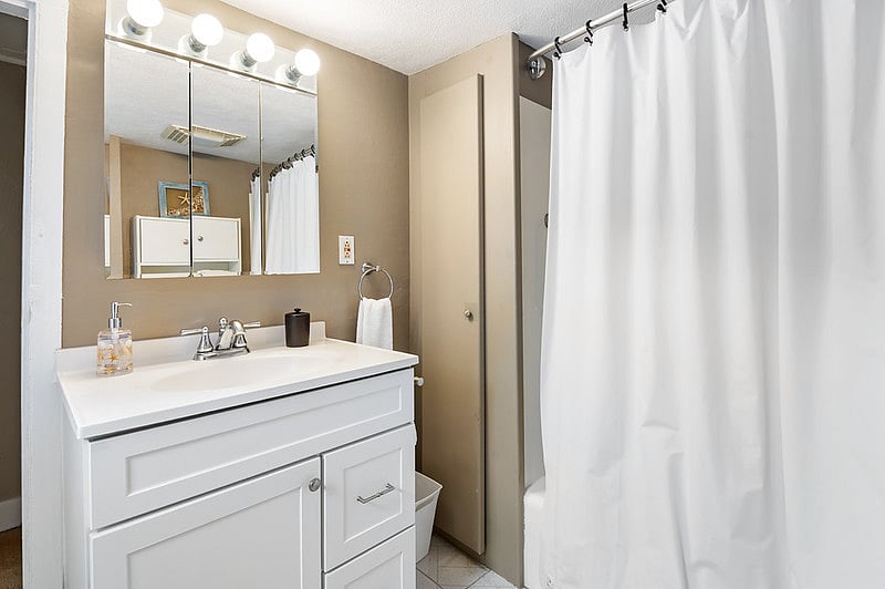 Full bathroom with a tub/shower and provided bathroom amenities.