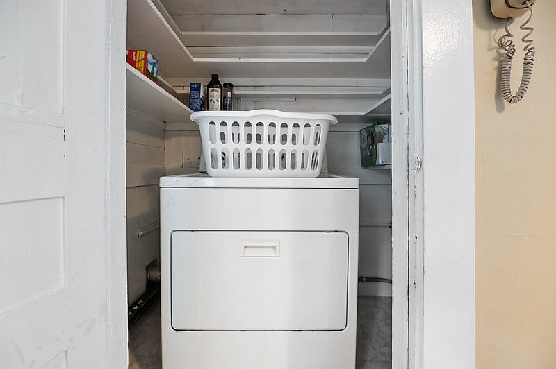 There is a washer and dryer in the kitchen area.