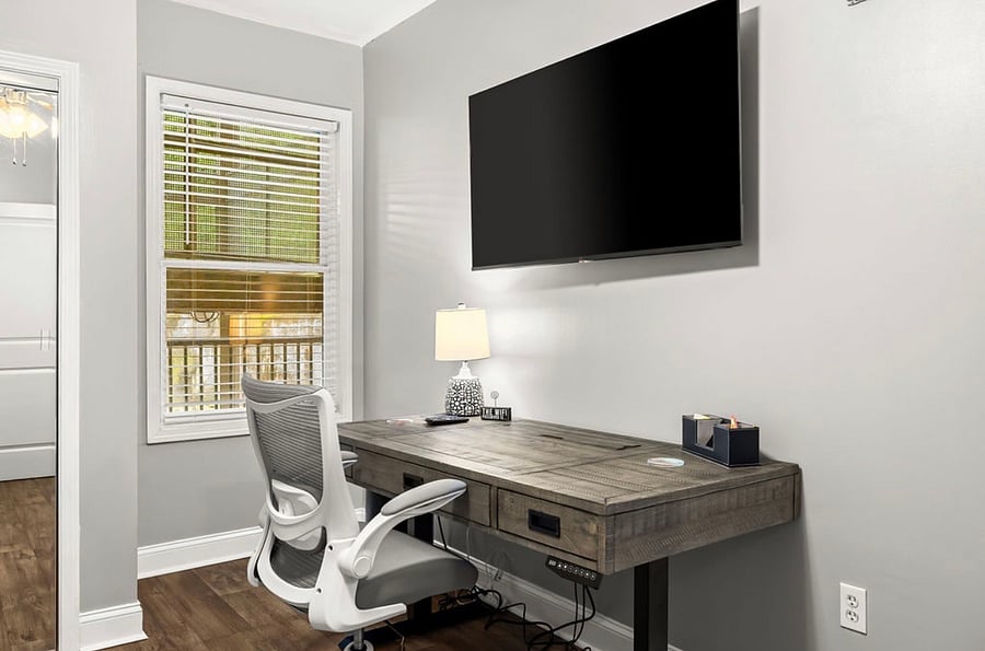 Twin trundle bedroom with closet and workspace with desk/chair.