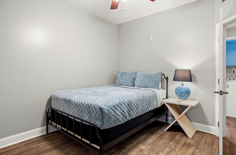 Queen bedroom with dresser and closet