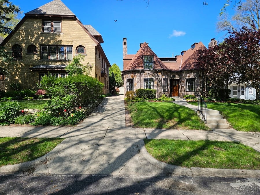 Single driveway for both units, off street parking is in the rear